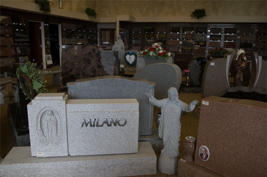 Inside the Milano Monuments showroom in Cleveland, rows of finished granite memorials and statuary